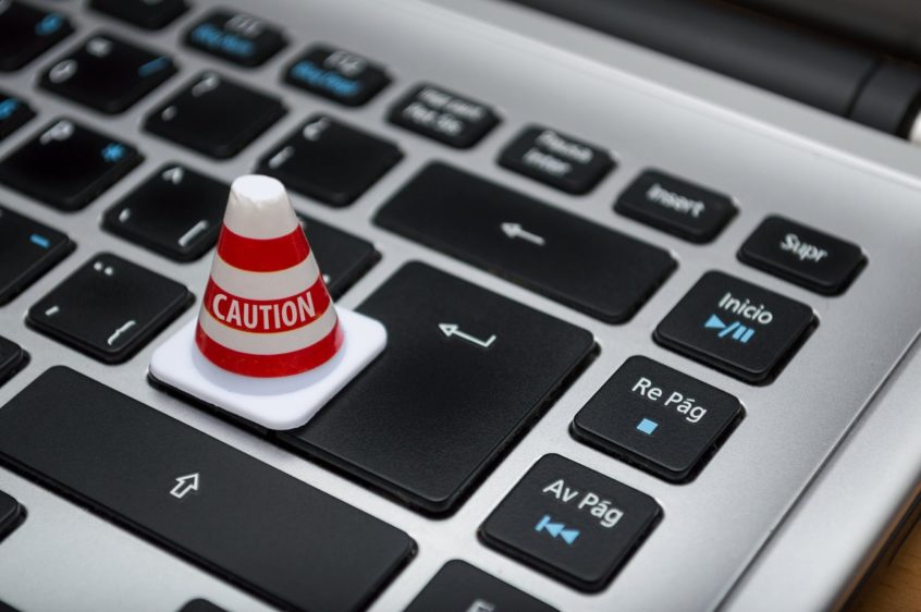 small caution cone on a keyboard