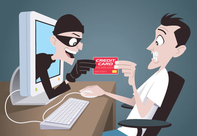 cartoon of burglar stealing credit card through computer screen