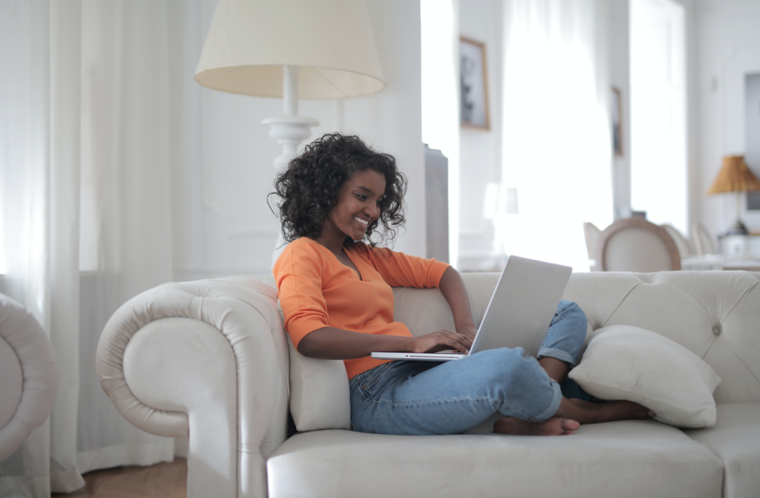 person on couch with laptop