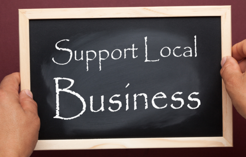 Chalkboard with "Support Local Business" written on it