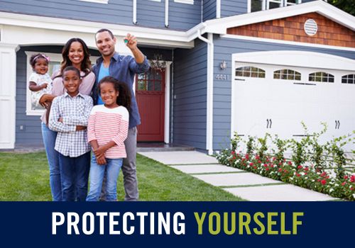 a family standing in front of a house